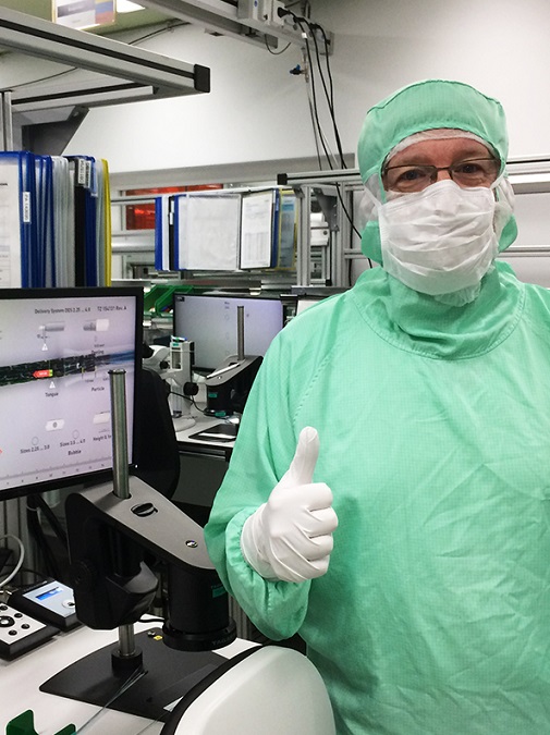 Microscope operator giving a thumbs up