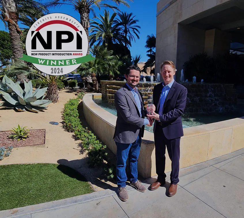 Jake Kurth from TAGARNO shaking hand with Mike Buetow from Circuits Assembly in sunny Anaheim while accepting an NPI award for the TAGARNO T50